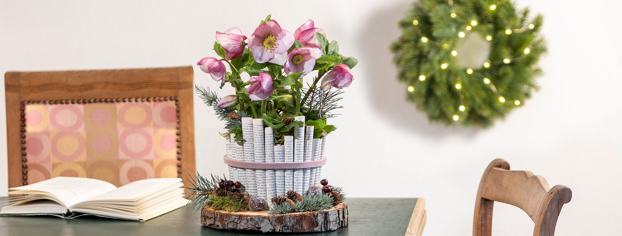 Christmas Rose in an upcycling planter with rolled up book pages